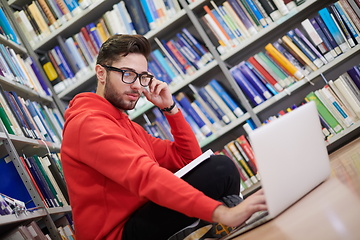 Image showing the students uses a notebook, laptop and a school library