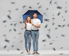 Image showing happy couple with umbrella standing money rain