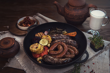 Image showing Grilled sausages with vegetables