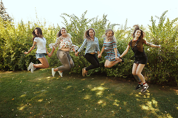 Image showing Happy women outdoors on sunny day. Girl power concept.