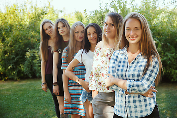 Image showing Happy women outdoors on sunny day. Girl power concept.