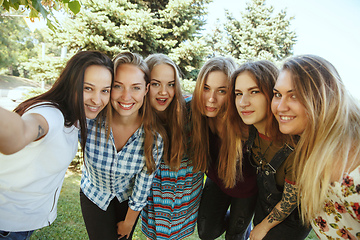 Image showing Happy women outdoors on sunny day. Girl power concept.