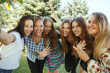 Image showing Happy women outdoors on sunny day. Girl power concept.