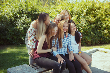 Image showing Happy women outdoors on sunny day. Girl power concept.