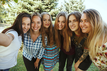 Image showing Happy women outdoors on sunny day. Girl power concept.