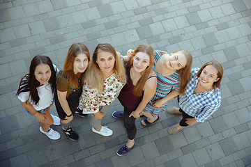 Image showing Happy women outdoors on sunny day. Girl power concept.