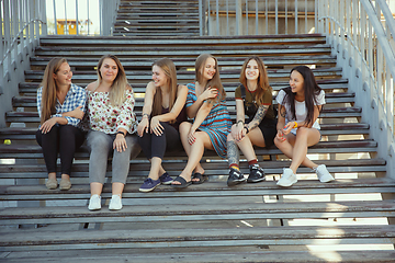 Image showing Happy women outdoors on sunny day. Girl power concept.