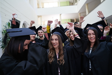 Image showing Group of diverse international graduating students celebrating