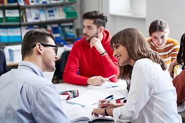 Image showing students group working on school project together on tablet computer at modern university