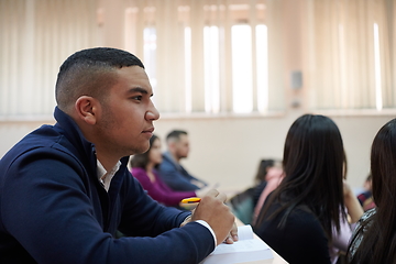 Image showing student taking notes while studying in high school