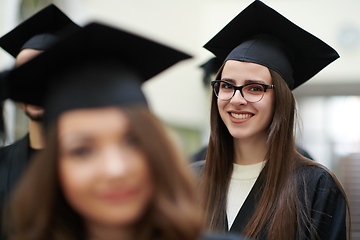 Image showing Group of diverse international graduating students celebrating