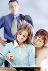 Image showing A family with a book