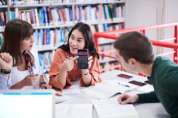 Image showing students group working on school project together on tablet computer at modern university