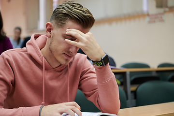 Image showing the student has a headache in class