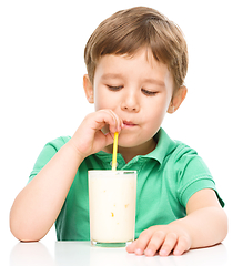 Image showing Cute little boy with a glass of milk