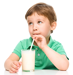 Image showing Cute little boy with a glass of milk