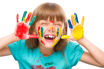 Image showing Portrait of a cute girl playing with paints