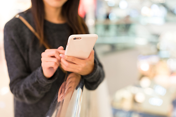 Image showing Woman use of cellphone in shopping mall