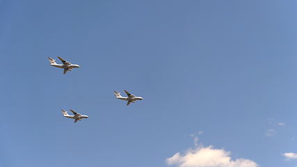 Image showing Military transport aircraft Il-72 fly in blue sky