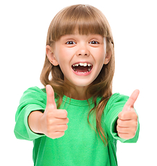 Image showing Little girl is showing thumb up sign