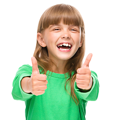 Image showing Little girl is showing thumb up sign