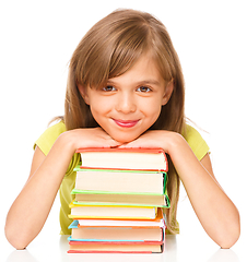 Image showing Little girl with her books