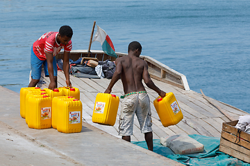 Image showing Malagasy men transport cargo from ship in port of Nosy Be, Madag