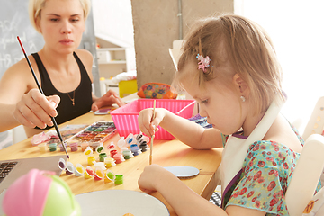 Image showing Cute little girl painting on home interior background