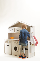 Image showing toddler girl playing with toy kitchen at home