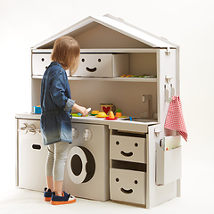 Image showing toddler girl playing with toy kitchen at home