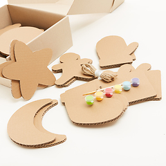 Image showing DIY christmas decorations from cardboard paper. Homemade Christmas ornament from reused paper. Craft ideas for kids.