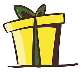 Image showing A yellow present box wrapped with decorative paper tied with a g