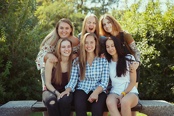 Image showing Happy women outdoors on sunny day. Girl power concept.