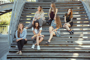 Image showing Happy women outdoors on sunny day. Girl power concept.