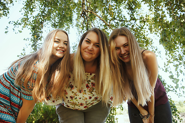 Image showing Happy women outdoors on sunny day. Girl power concept.