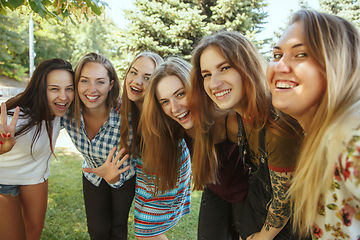 Image showing Happy women outdoors on sunny day. Girl power concept.