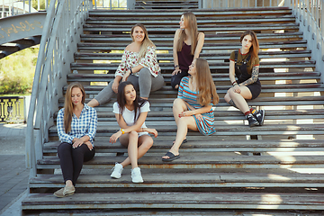 Image showing Happy women outdoors on sunny day. Girl power concept.