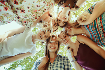 Image showing Happy women outdoors on sunny day. Girl power concept.