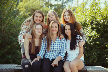 Image showing Happy women outdoors on sunny day. Girl power concept.