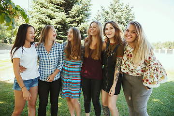 Image showing Happy women outdoors on sunny day. Girl power concept.