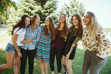 Image showing Happy women outdoors on sunny day. Girl power concept.