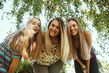 Image showing Happy women outdoors on sunny day. Girl power concept.