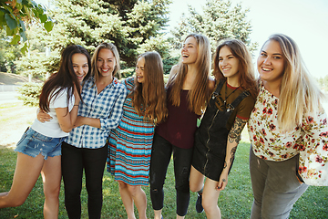 Image showing Happy women outdoors on sunny day. Girl power concept.