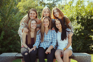 Image showing Happy women outdoors on sunny day. Girl power concept.