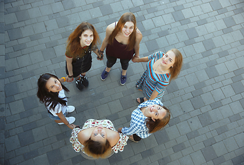 Image showing Happy women outdoors on sunny day. Girl power concept.