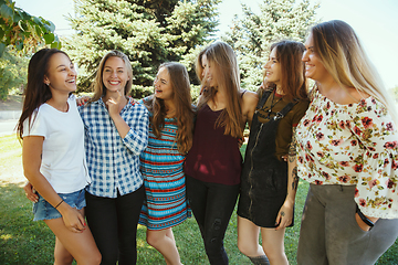 Image showing Happy women outdoors on sunny day. Girl power concept.