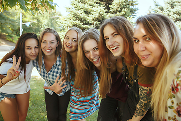 Image showing Happy women outdoors on sunny day. Girl power concept.