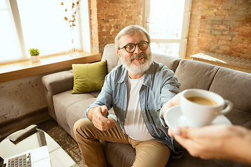 Image showing Senior man working with laptop at home - concept of home studying