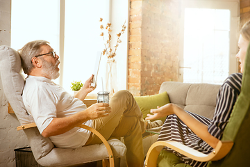 Image showing Senior man working with tablet at home - concept of home studying