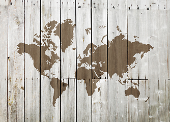 Image showing World map on a wooden wall